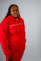 Sky High Stacked Jogging Sets in vibrant red, worn by a smiling model showcasing the ENDLESS HEIGHTS tracksuit.